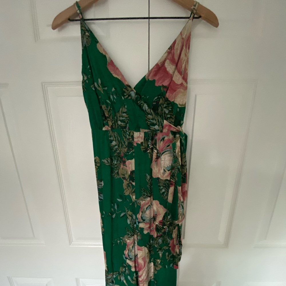 Jumpsuit, green with pink flowers. Bright colors, smooth fabric.